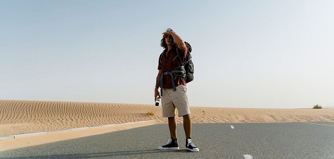 a man standing on the road in dubai